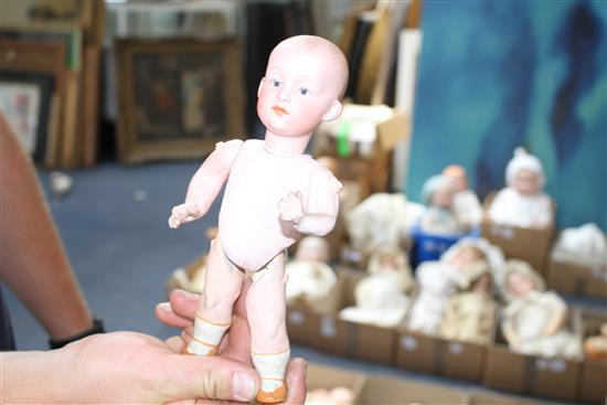 A Heubach character doll, intaglio eyes, 8in., a German all bisque baby, 4in. and a German character baby, composition body, 9in. (3)